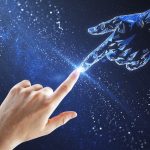 human and android hands with fingertips touching
