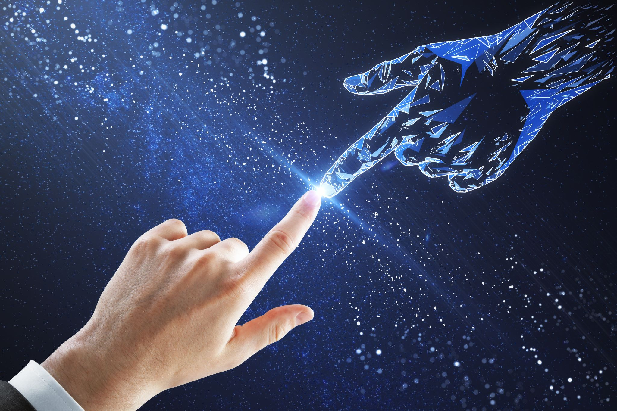 human and android hands with fingertips touching