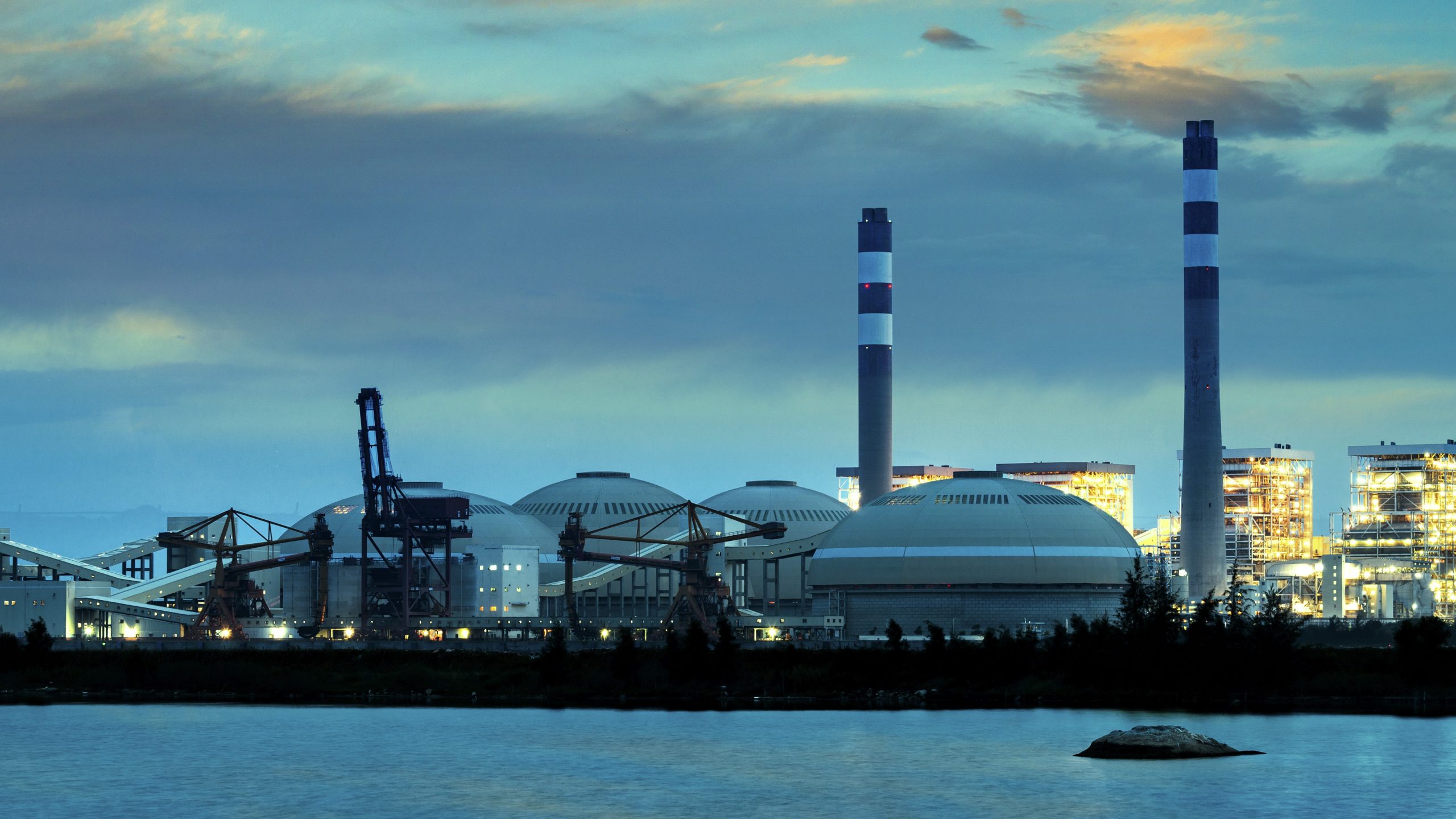 Industrial power plant with towers and cloudscape